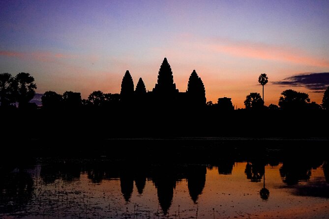 Angkor Sunrise Vespa Tour / Tuk Tuk or Car - Angkor Thom and Bayon giant faces: riding, then staring up