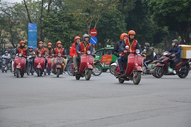 Hanoi By Vespa Tours: HISTORY + CULTURE + SIGHT + FUN 2,5 Hours - The Long Bien Bridge Ride and the Dong Xuan Market Pass-By