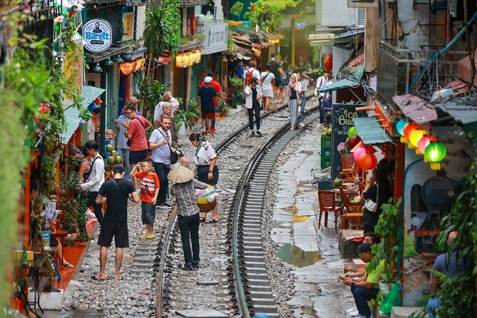 Hanoi Vespa After Dark Street food + Train Street+ Live Music - Stop 4: Long Bien Bridge Viewpoint and Red River Night Air