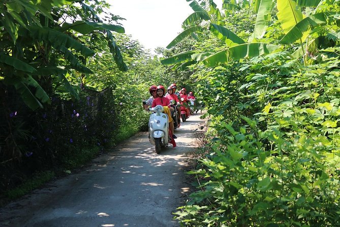 Hanoi Vespa Countryside Tour With Female Ao Dai Riders Half Day - Stop 1: Hoan Kiem Lake area, plus that countryside-to-city contrast