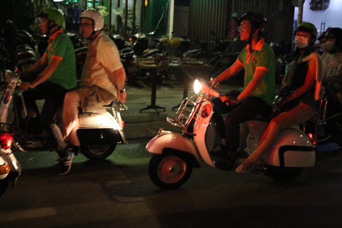 Saigon After Dark Vespa Street Food Tour + Live Music 4 hours - Stop 3: banana cake and learning how street snacks fit Saigon life