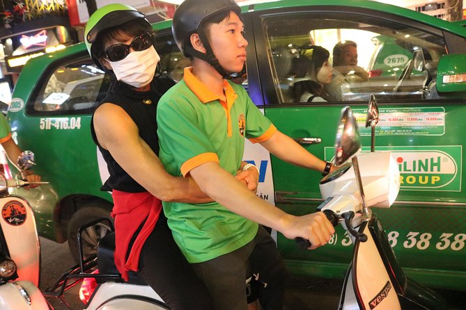 Saigon Vespa By Night Street Food Tour 4,5 Hours - Vintage Vespa at dusk: the quickest way to feel Saigon