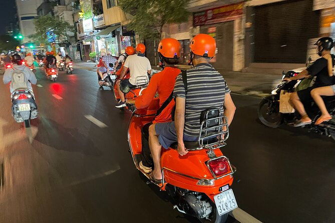 Vespa Female Ao Dai riders Night Street Food + See Train Street - Old-to-new streets: St. Joseph’s Cathedral and the Mosaic Road pass-bys